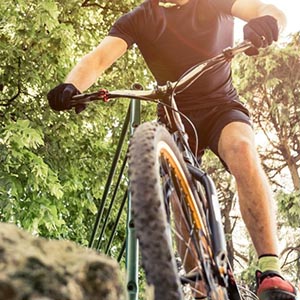 Sport guy making downhill on his mountain bikefeatured image